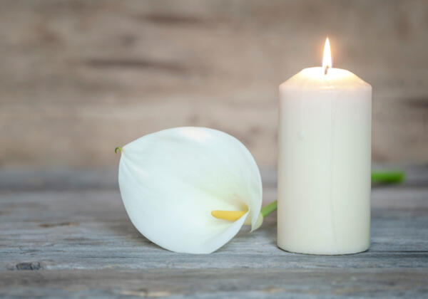 White candles burning for funeral in Benalla